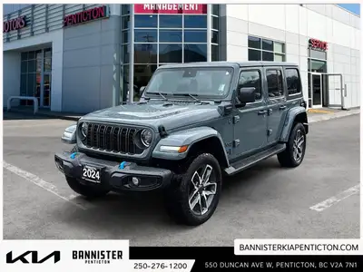 Step into adventure with the 2024 Jeep Wrangler 4xe Sport S, a versatile SUV in a stunning silver fi...