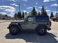 This Jeep Wrangler delivers a Gas/Electric V-6 3.6 L/220 engine powering this Automatic transmission... (image 3)