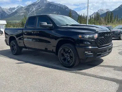 A deep Diamond Black Crystal finish gives this 2026 Ram 1500 a sharp, polished presence, while the n...