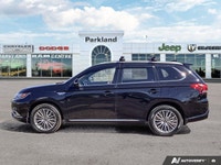The 2022 Mitsubishi Outlander PHEV Black Edition brings together modern efficiency, bold styling, an... (image 1)