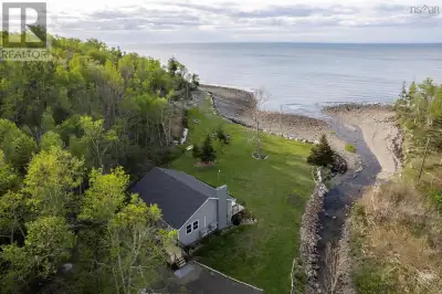 Nestled on 16 acres with direct Bay of Fundy shore frontage, this hidden gem offers exceptional priv...