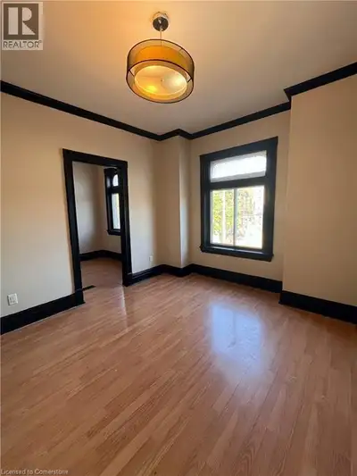 Wake up to sunshine in this cozy 1-bedroom on the second floor of a charming century home! With east...