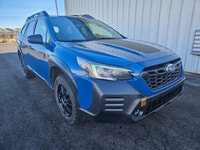 The 2022 Subaru Outback Wilderness in a striking blue finish with an all-wheel-drive system is your... (image 8)