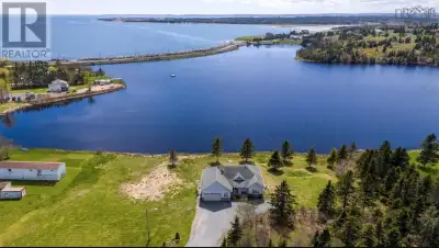 Welcome to 1480 Cow Bay Roada beautifully designed lakefront home offering expansive views of the At...