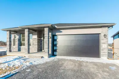 In Town living with country views, with in law suite potential! This new 3+1 bed, 3 bathroom bungalo...