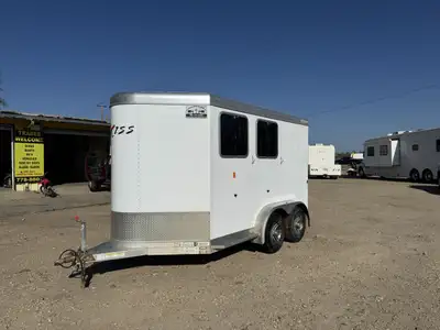 The Exiss 2H straight load bumper pull trailer features a fully appointed dressing room, standard re...