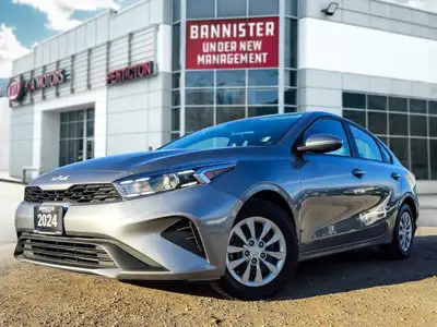 Experience the sophisticated charm of the 2024 Kia Forte LX IVT, presented in a sleek Gray finish wi...