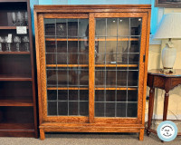 ANTIQUE OAK BOOKCASE WITH LEADED GLASS SLIDING DOOR AT CHARMAINE