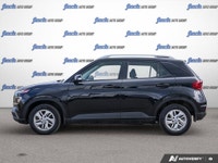 Discover the 2020 Hyundai Venue Preferred: a sleek, black subcompact SUV designed for urban adventur... (image 1)