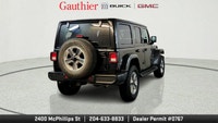 The 2022 Jeep Wrangler Unlimited Sahara is a versatile 4-door SUV that blends classic Jeep off-road... (image 2)