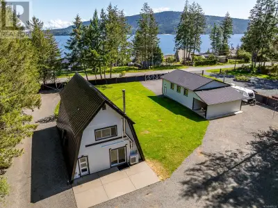 Immaculate turn-key property with an exquisite(1929 square foot) A-frame style home that has been me...