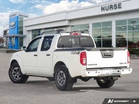 Ready for any adventure or workday, this 2018 Nissan Frontier Crew Cab Pickup in striking Glacier Wh... (image 2)