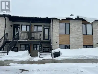 Modern 2-bedroom, 2-bathroom stacked townhome offering an open-concept design. The thoughtfully desi...