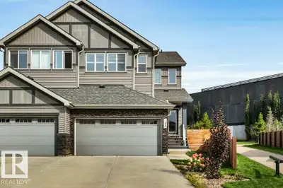 Welcome to this modern half duplex in Jensen Lakes, a beautiful private lake community offering exce...