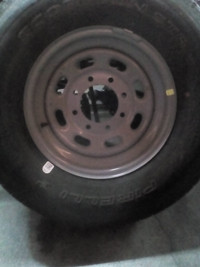 18 inch TRUCK Tire, and 8 bolt  rim, NEW.  It was the spare.