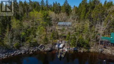 BOAT ACCESS ONLY. Nestled in the serene woods on beautiful Lake Charlotte, this charming five bedroo...