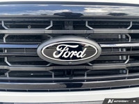 The 2026 Ford F-150 XLT, dressed in a striking Oxford White finish, showcases a commanding 4x4 drive... (image 9)