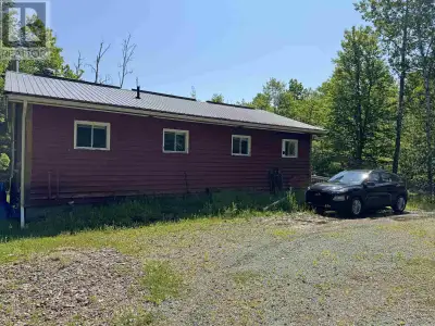 Welcome to this inviting four-season home or cottage nestled in a peaceful, private setting with dee...