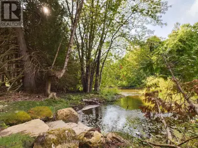 Welcome to Crawford! This expansive 30-acre property boasts a picturesque river and breathtaking vie...