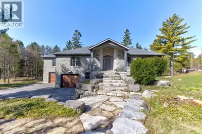 RARE OPPORTUNITY! Custom built raised bungalow on a 1.04-acre lot, offering court location surrounde...