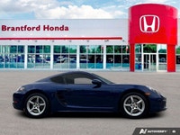 Feel the exhilaration of the open road with this stunning 2020 Porsche 718 Cayman in vibrant Gentian... (image 6)