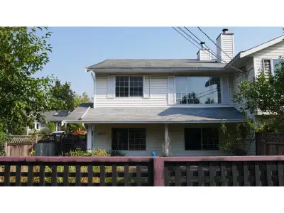 A rare opportunity to own a corner 1/2 duplex with back lane access and exciting future potential. A...