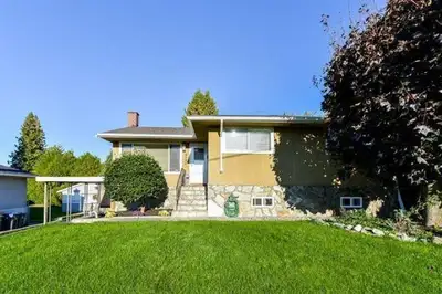 This tastefully renovated upper floor of this home has a stunning view of the Fraser River with 3 be...