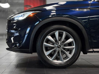 The 2021 INFINITI QX50 Essential is a premium-mid-level trim that elevates the compact luxury SUV ex... (image 7)