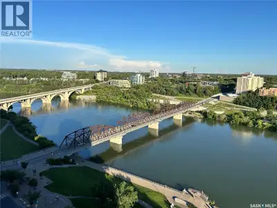 18th-floor, 2 bedroom + den at Saskatoon's landmark No. 1 River Landing, offering unreal panoramic v...