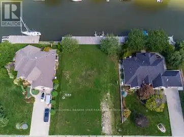 Build your dream home on this exceptional waterfront property in Lighthouse Cove! This rare offering...