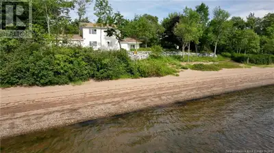 A rare chance to own over 2 acres of waterfront land with 628 feet of sandy beach on the Kennebecasi...