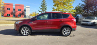 Our 2015 Ford Escape Titanium in Sunset Orange is in stock and ready for your driveway! Call to book... (image 1)