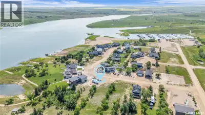Fully serviced and sheltered private and titled LAKEFRONT lot with 2000gal septic tank, electric, an...
