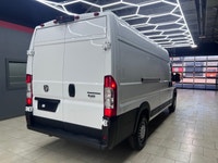 The 2025 Ram ProMaster Cargo Van in a clean white finish, equipped with front-wheel drive, is design... (image 4)