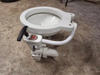 New under water toilet, never installed, was in storage for many years, comes with a seat ,seat has...