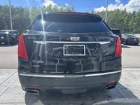 The 2019 Cadillac XT5 Luxury AWD, finished in black with a black leather interior, offers a refined... (image 6)