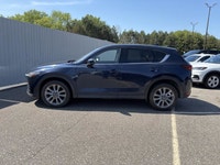 Finished in blue with a black interior, this used 2021 Mazda CX-5 GT AWD brings together upscale com... (image 1)