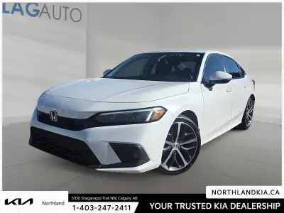 This used 2022 Honda Civic Touring for sale in Calgary has just 82946 km and is finished in Platinum...