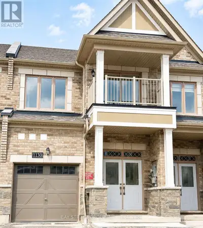 Modern freehold 2-storey townhouse for lease featuring 3 bedrooms, 3 bathrooms, and a finished basem...
