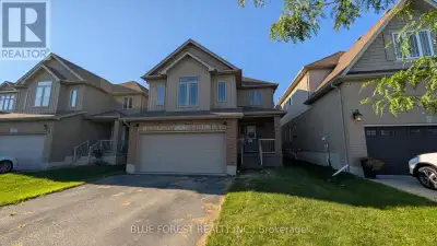 Spacious open concept two storey home on quiet street. Large living room open to bright white kitche...