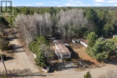 Welcome to Shady Pines Mobile Home Park! This charming home features a bright and open layout with t...