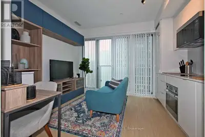 Live in the heart of the city at 7 Grenville! This sleek junior one-bedroom offers modern finishes a...