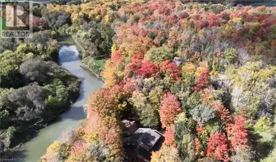 Welcome home to RIVERBEND - a truly one-of-a-kind riverside retreat nestled on a breathtaking 3-acre...