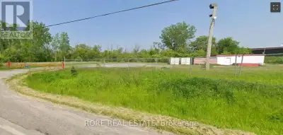 Huge gated/fenced lot with power, gas, water and small storage building only minutes to QEW and US B...