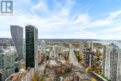 This southwest facing unit in the prestigious One Burrard Place development boasts 2 bedrooms, 2 bat...