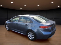 The 2021 Toyota Corolla LE in sleek gray with its reliable front-wheel drive and automatic transmiss... (image 7)
