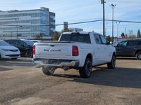 The 2026 Ram 1500 Longhorn Crew Cab in Ivory Tricoat Pearl combines rugged capability with refined l... (image 6)