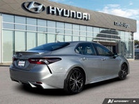 The *2024 Toyota Camry Hybrid SE* combines aggressive sport styling with class-leading fuel efficien... (image 4)