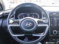 The 2023 Hyundai Tucson Preferred, featuring a brilliant Crystal White exterior complemented by a re... (image 9)