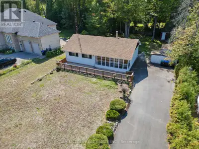 This Lovely 3 Bedroom Bungalow Home Resides on Picturesque 86 x 180 Expansive Double Lot with all Mu...
